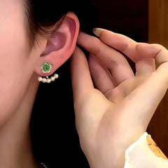 Close-up detail of the sparkling zircons and plating on the Rose Pearl Ear Jackets