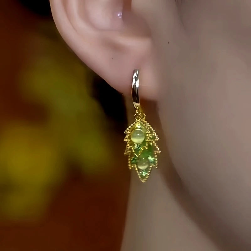 Close-up detail of the sparkling zircons and plating on the Cat's Eye Leaf Earrings