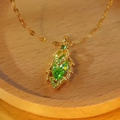 Detailed view of the 14K Gold-Plated Green Zircon Diamond Leaf Necklace chain and pendant
