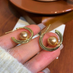 Angled view of the 14K Gold-Plated Hanging Moon Bead Hoop Earrings