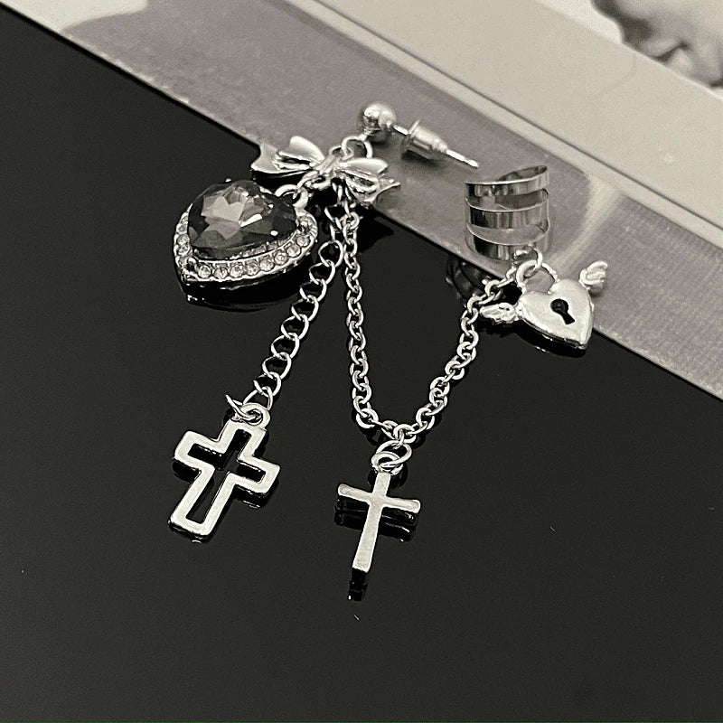 Model showcasing the dangle and style of the 14K Gold-Plated Heart-Design Cross Ear Clip Tassel Earrings