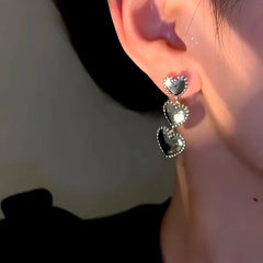 Close-up detail of the sparkling zircons and plating on the Textured Heart Dangle