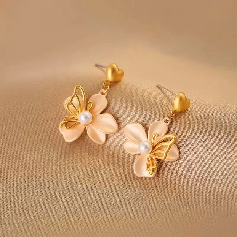 Close-up detail of the sparkling zircons and plating on the Heart Flower Earrings