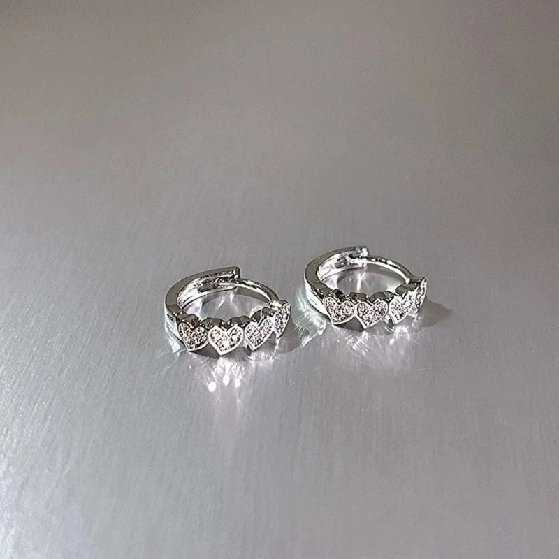 Angled view of the 14K Gold-Plated Heart-Design Little Hoop Earrings