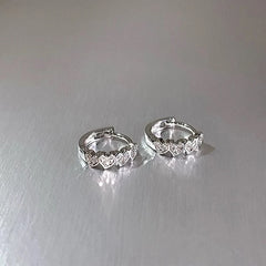 Angled view of the 14K Gold-Plated Heart-Design Little Hoop Earrings