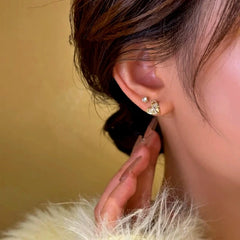 Close-up detail of the sparkling zircons and plating on the Pave Heart Studs