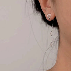 Angled view of the 14K Gold-Plated Heart Design Ear Clip Tassel Earrings