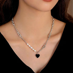 Close-up of the pendant and clasp on the Heart Pearl Necklace