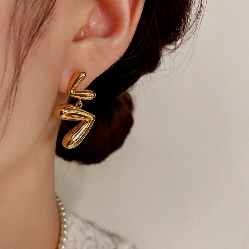 Close-up detail of the sparkling zircons and plating on the Open Heart Tassel