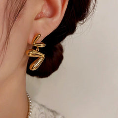 Close-up detail of the sparkling zircons and plating on the Open Heart Tassel