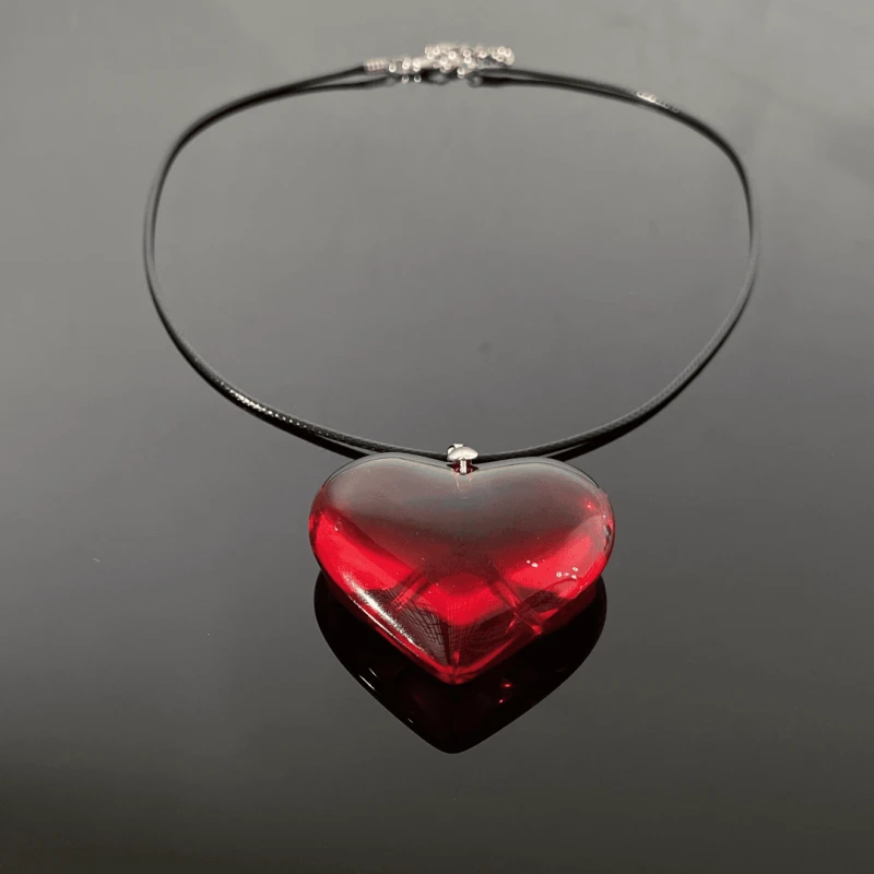 Close-up of the pendant and clasp on the Red Heart Necklace
