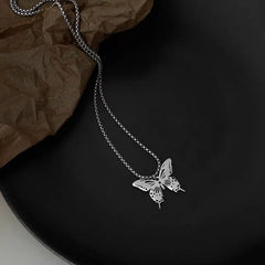 Close-up of the pendant and clasp on the Hollow Butterfly Necklace