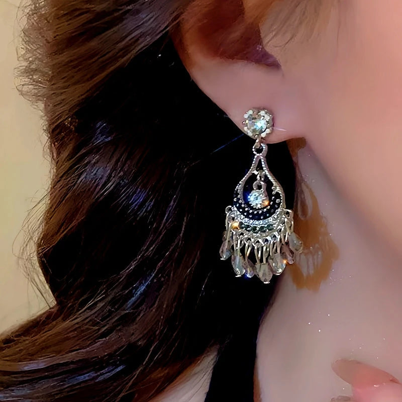 Close-up detail of the sparkling zircons and plating on the Hollow Tassel Earrings