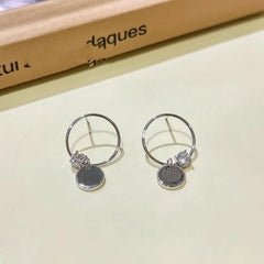 Close-up detail of the sparkling zircons and plating on the Diamond Shape Hoops