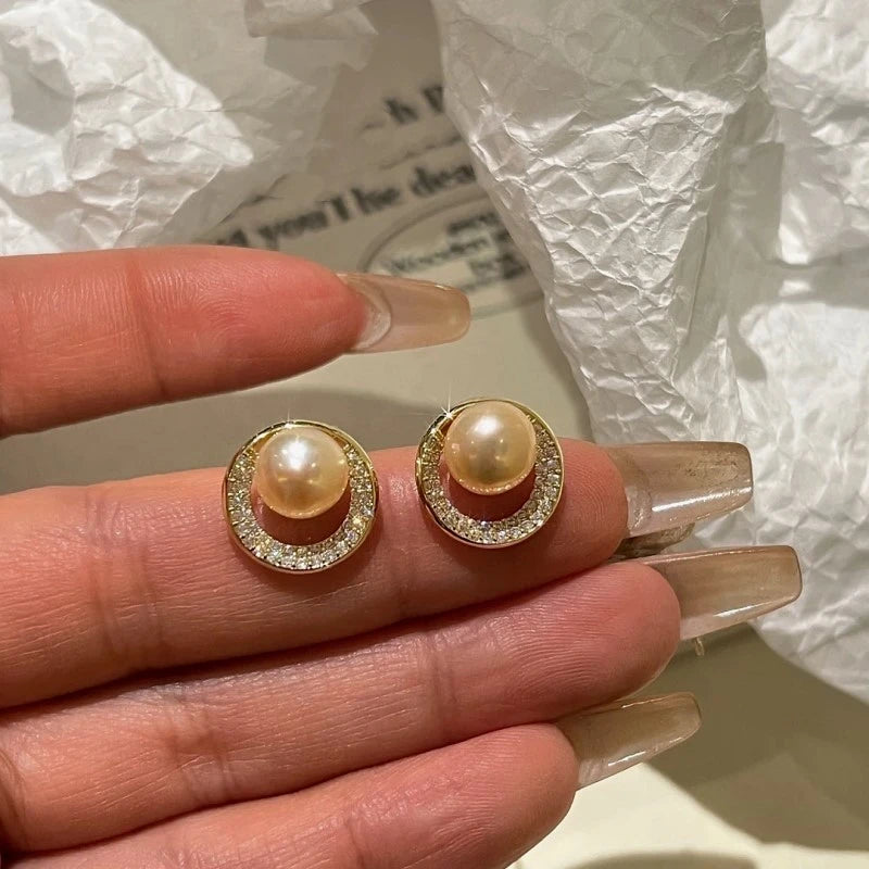 Close-up detail of the sparkling zircons and plating on the Pearl Studs