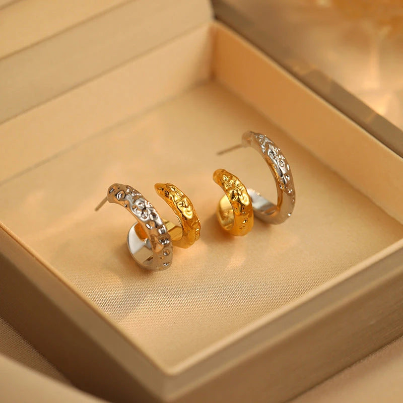 Angled view of the 14K Gold-Plated Hollow Double-Layer Stud Earrings