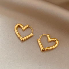 Angled view of the 14K Gold-Plated Hollow Heart Earrings