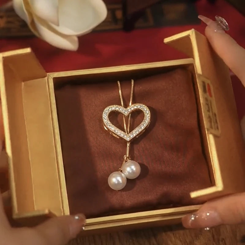 14K Gold-Plated Hollow Heart Pearl Necklace worn to showcase its length and pendant detail