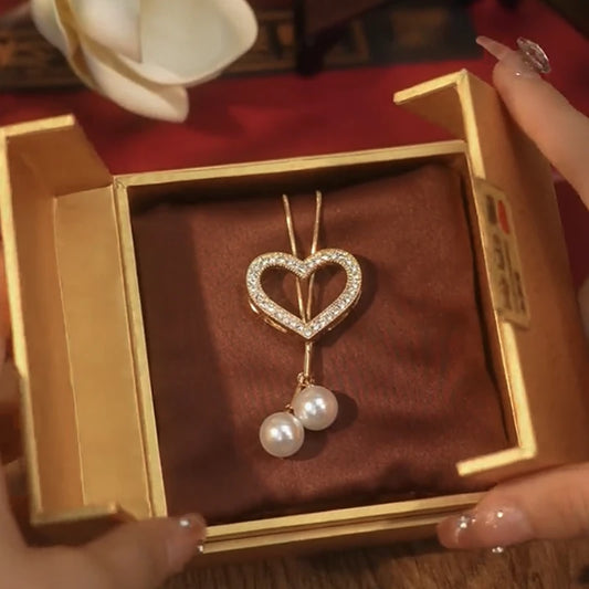 14K Gold-Plated Hollow Heart Pearl Necklace worn to showcase its length and pendant detail