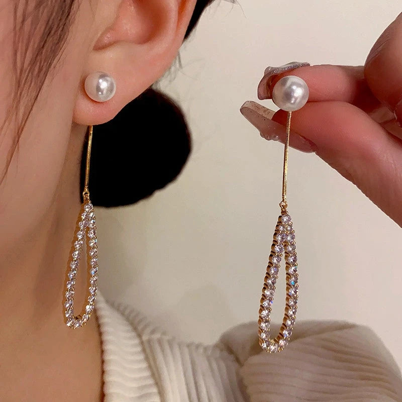 Close-up detail of the sparkling zircons and plating on the Pearl Tassel Earrings