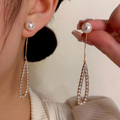Close-up detail of the sparkling zircons and plating on the Pearl Tassel Earrings