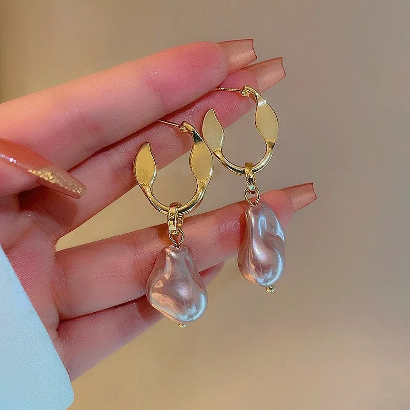 Angled view of the 14K Gold-Plated Irregular Pearl Earrings