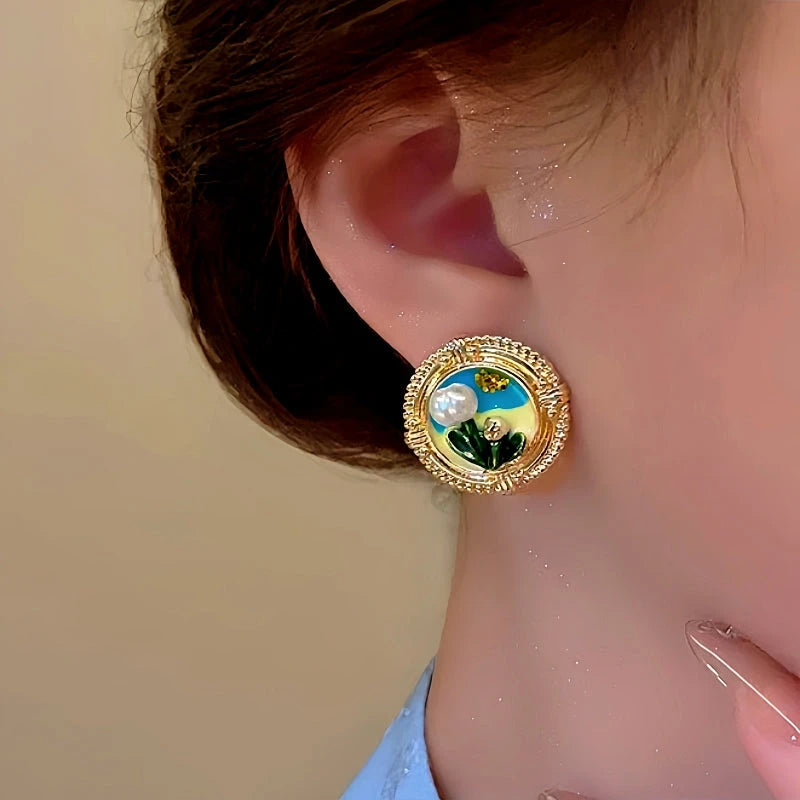 Model showcasing the dangle and style of the 14K Gold-Plated Irregular Pearl Flower Earrings