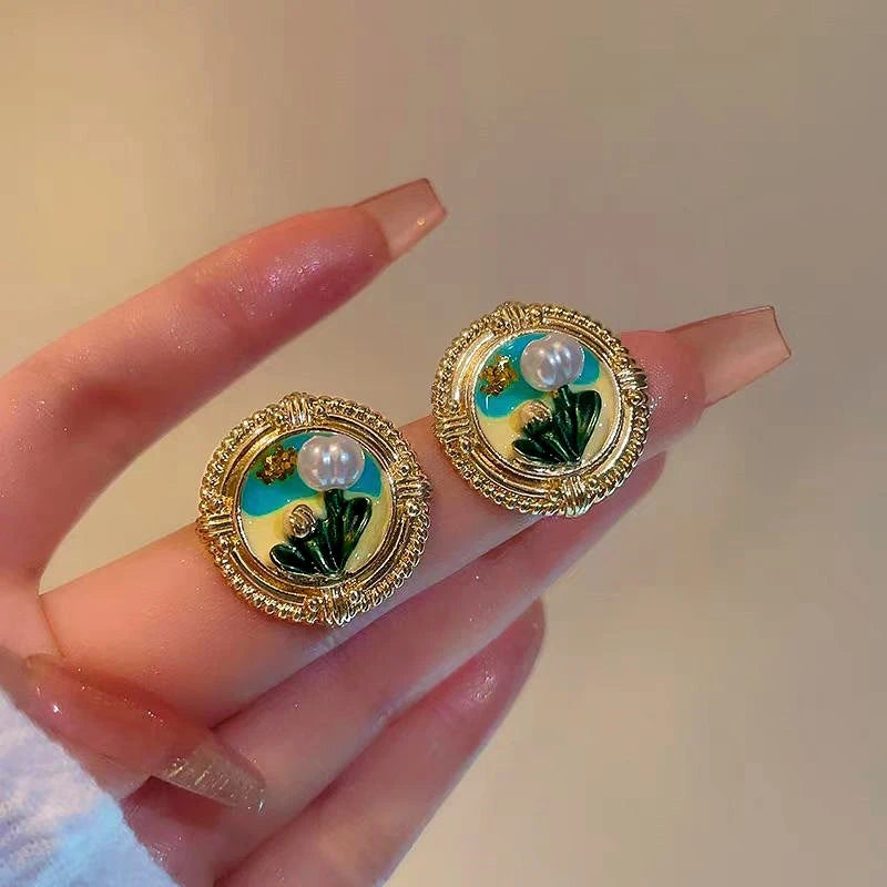 Angled view of the 14K Gold-Plated Irregular Pearl Flower Earrings