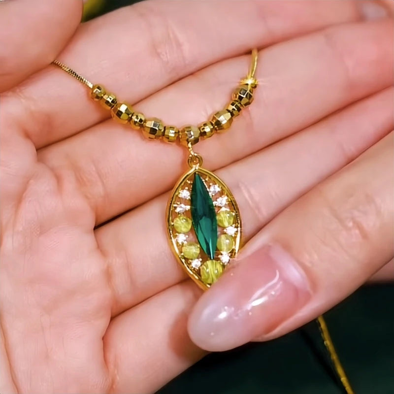 Close-up of the pendant and clasp on the Carved Jade Leaf