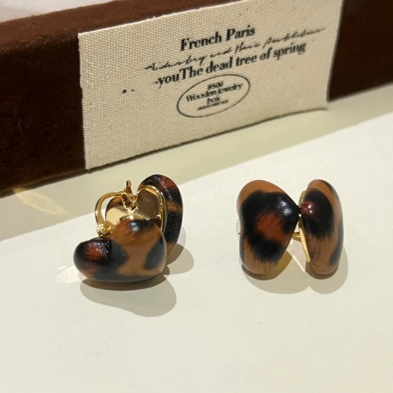 Angled view of the 14K Gold-Plated Leopard Heart Earrings