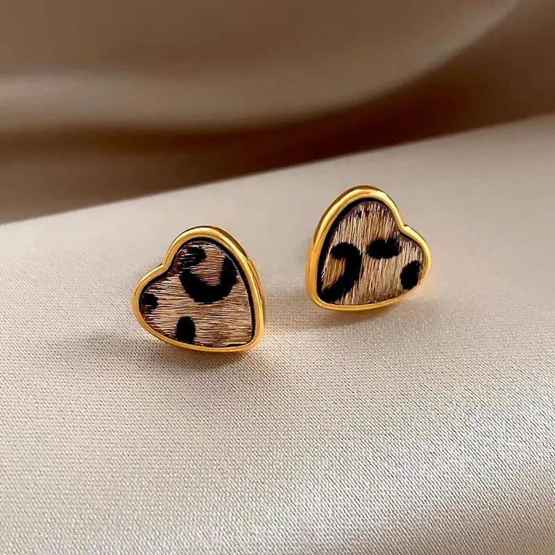 Close-up detail of the sparkling zircons and plating on the Leopard Heart Studs