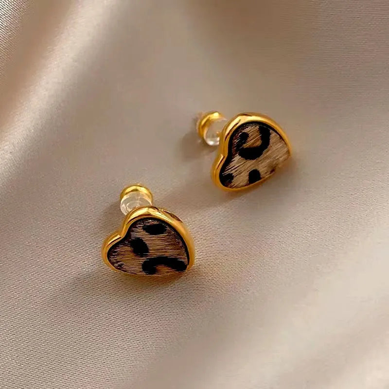 Angled view of the 14K Gold-Plated Leopard Print Small Heart Stud Earrings