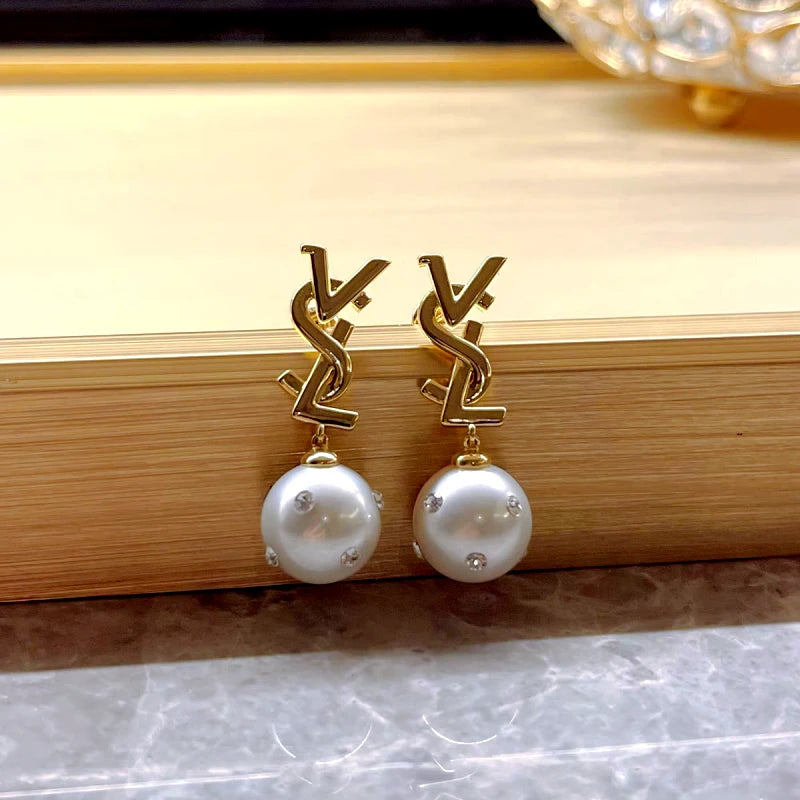 Angled view of the 14K Gold-Plated Letter Diamond Pearl Earrings