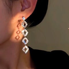 Close-up detail of the sparkling zircons and plating on the Crystal Tassel Earrings