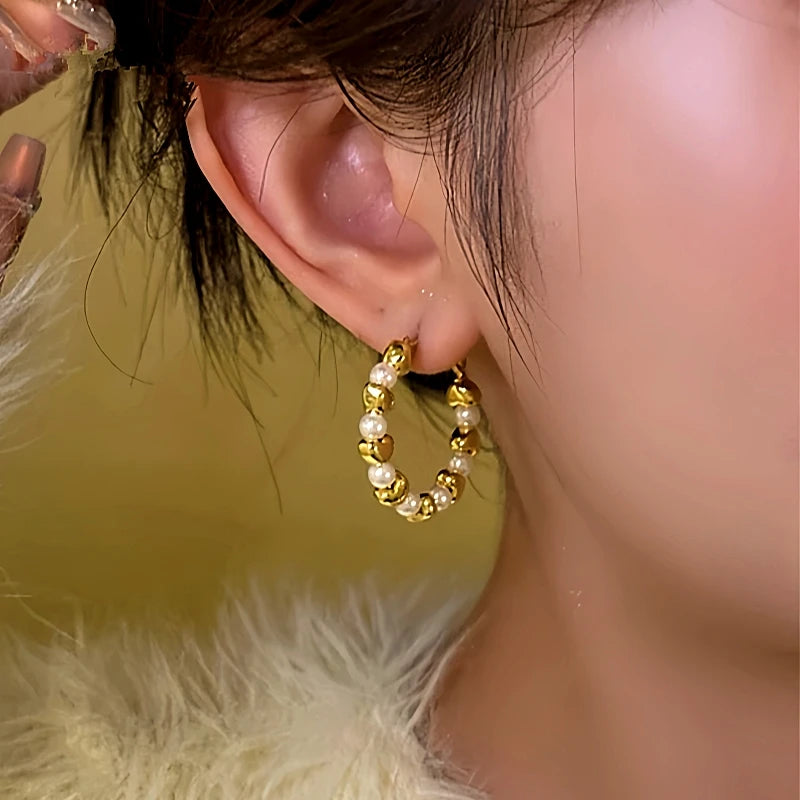 Close-up detail of the sparkling zircons and plating on the LOVE Hoop Earrings