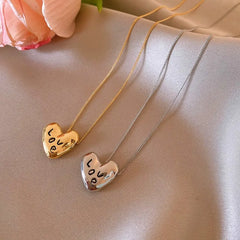 The perfect Love Script Necklace for layering or wearing as a statement piece