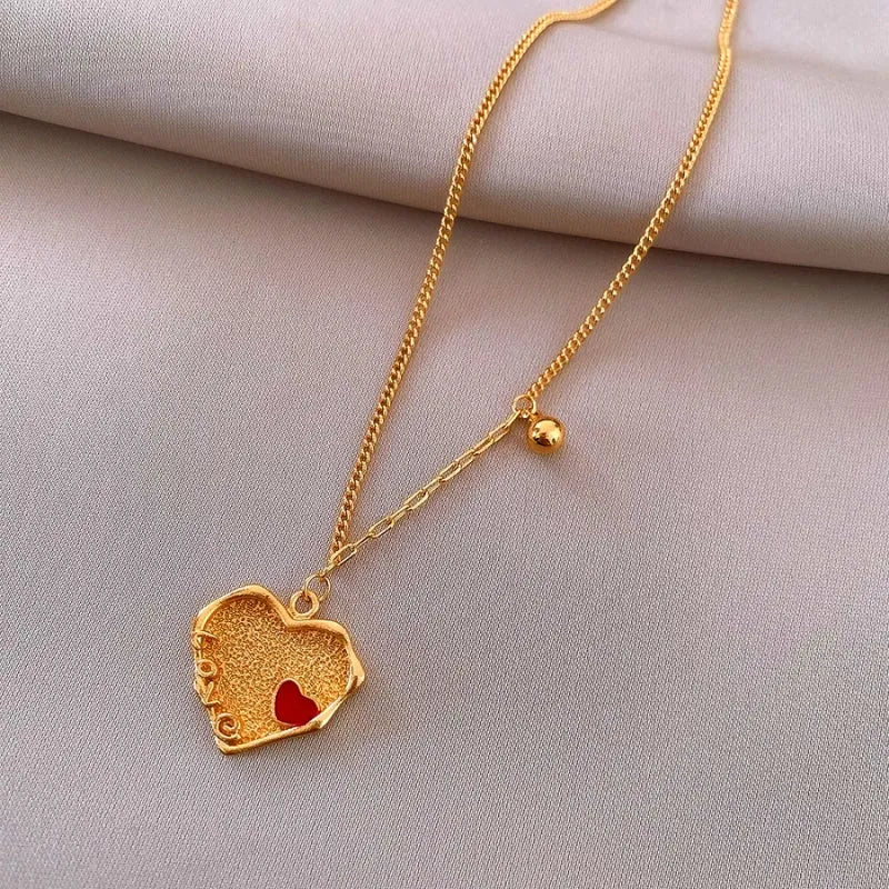 Close-up of the pendant and clasp on the Red Heart Necklace