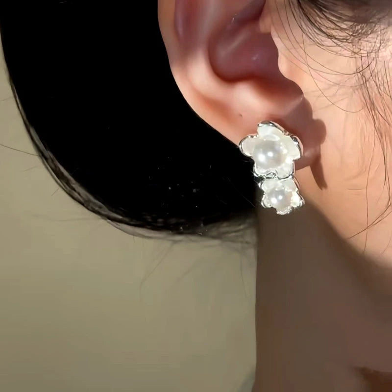 Close-up detail of the sparkling zircons and plating on the Asymmetrical Pearl Earrings