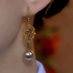 Close-up detail of the sparkling zircons and plating on the Brown Leaf Tassel