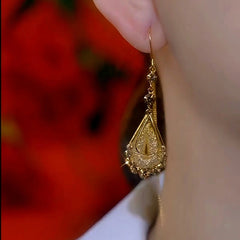 Angled view of the 14K Gold-Plated Luxury Brown Diamond Mesh Water Drop Threader Earrings