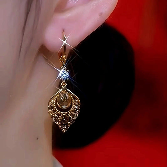 Model showcasing the dangle and style of the 14K Gold-Plated Luxury Brown Diamond Rest Of My Life With You Earrings