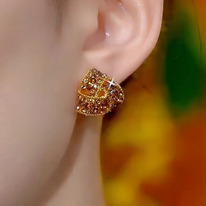 Close-up detail of the sparkling zircons and plating on the Brown Triangle Studs