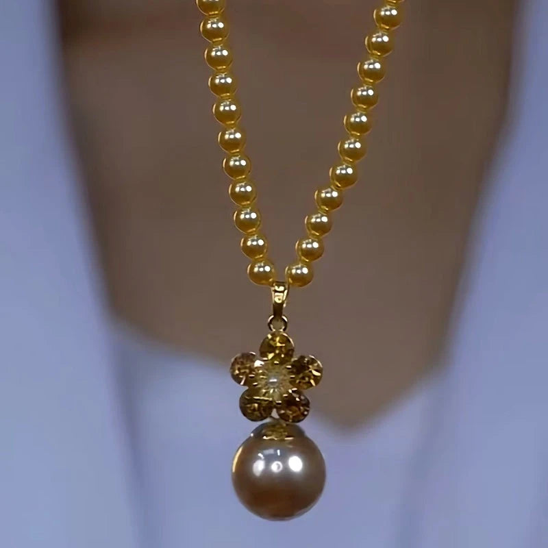14K Gold-Plated Luxury Brown Zircon Pearl Necklace worn to showcase its length and pendant detail