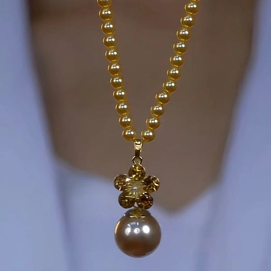 14K Gold-Plated Luxury Brown Zircon Pearl Necklace worn to showcase its length and pendant detail