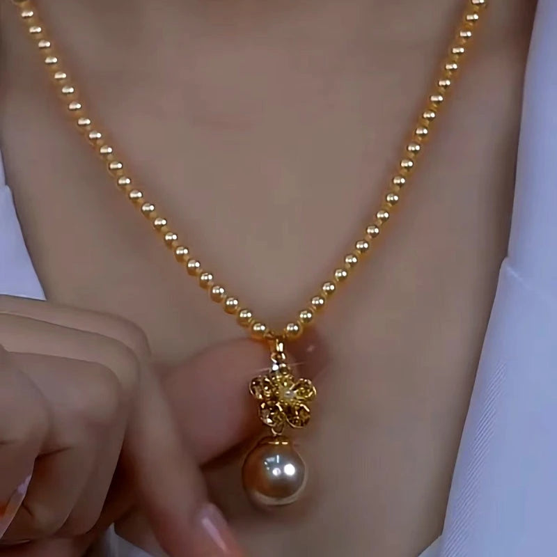 Close-up of the pendant and clasp on the Baroque Pearl Necklace