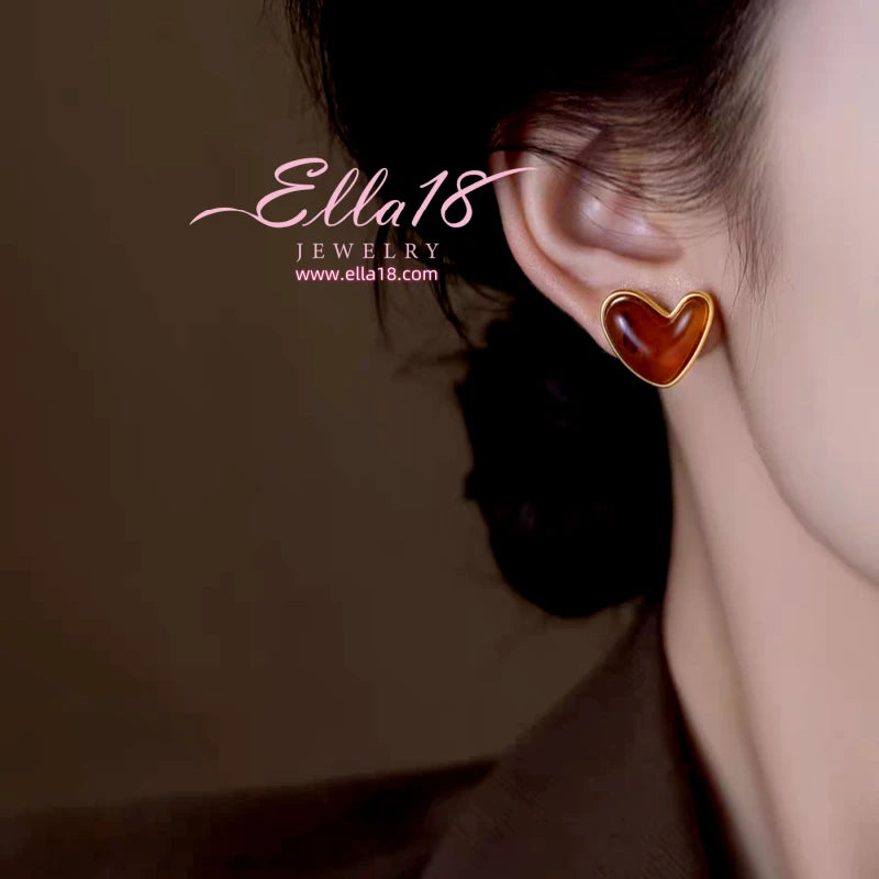 Close-up detail of the sparkling zircons and plating on the Cat's Eye Heart Studs