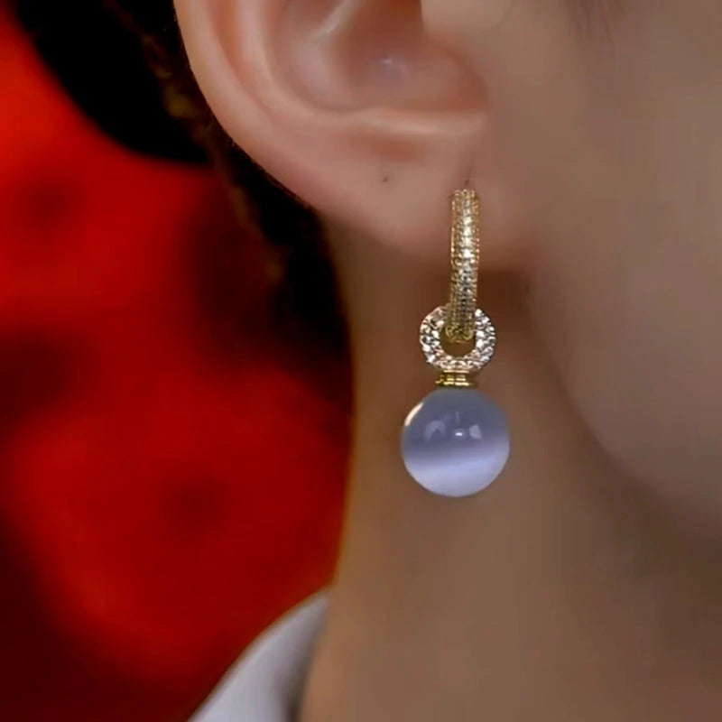 Close-up detail of the sparkling zircons and plating on the Cat's Eye Drops