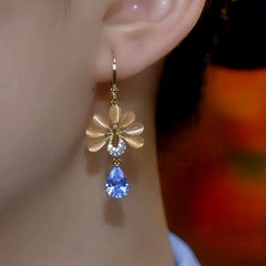 Close-up detail of the sparkling zircons and plating on the Cat's Eye Flower