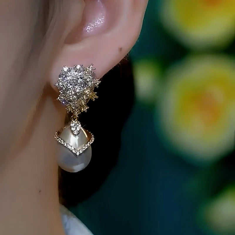 Close-up detail of the sparkling zircons and plating on the Champagne Pearl Earrings