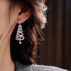 Model showcasing the dangle and style of the 14K Gold-Plated Luxury Colorful Diamond Christmas Tree Earrings